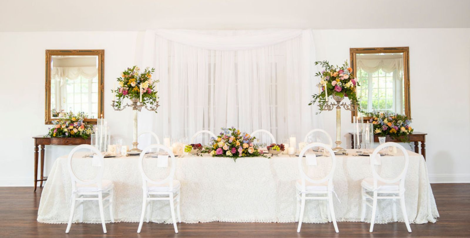 a table with flowers and candles
