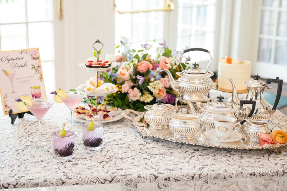 a table with tea set and flowers