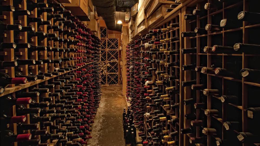 a wine cellar with many bottles