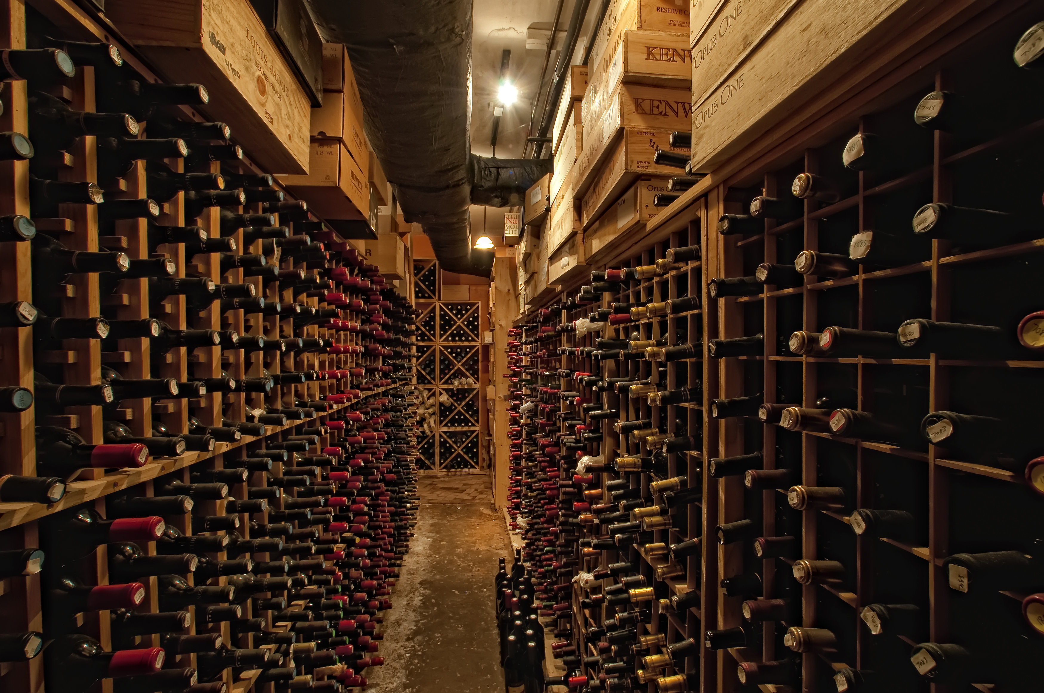 a wine cellar with many bottles