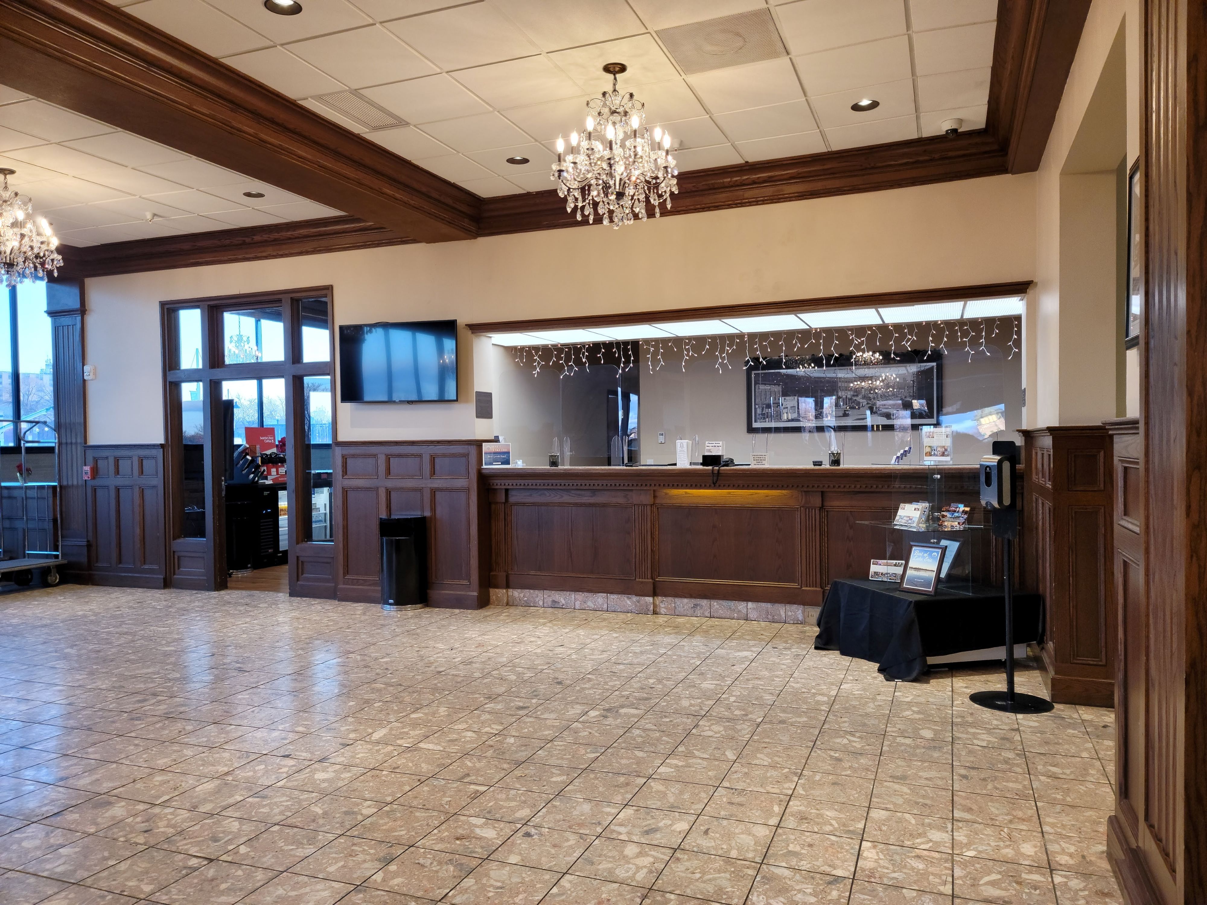 a room with a chandelier and a counter