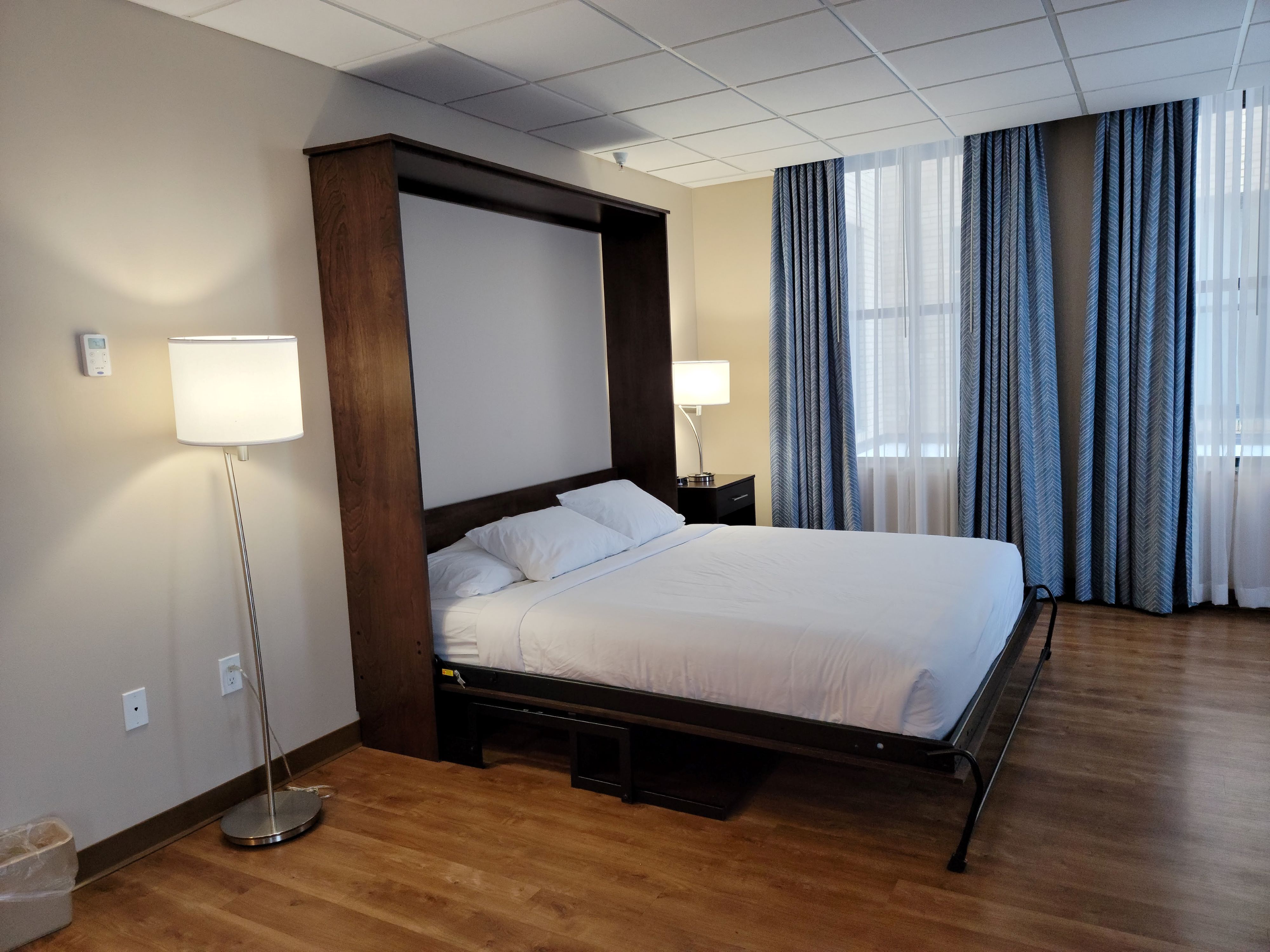 a bed with a wall mounted bed