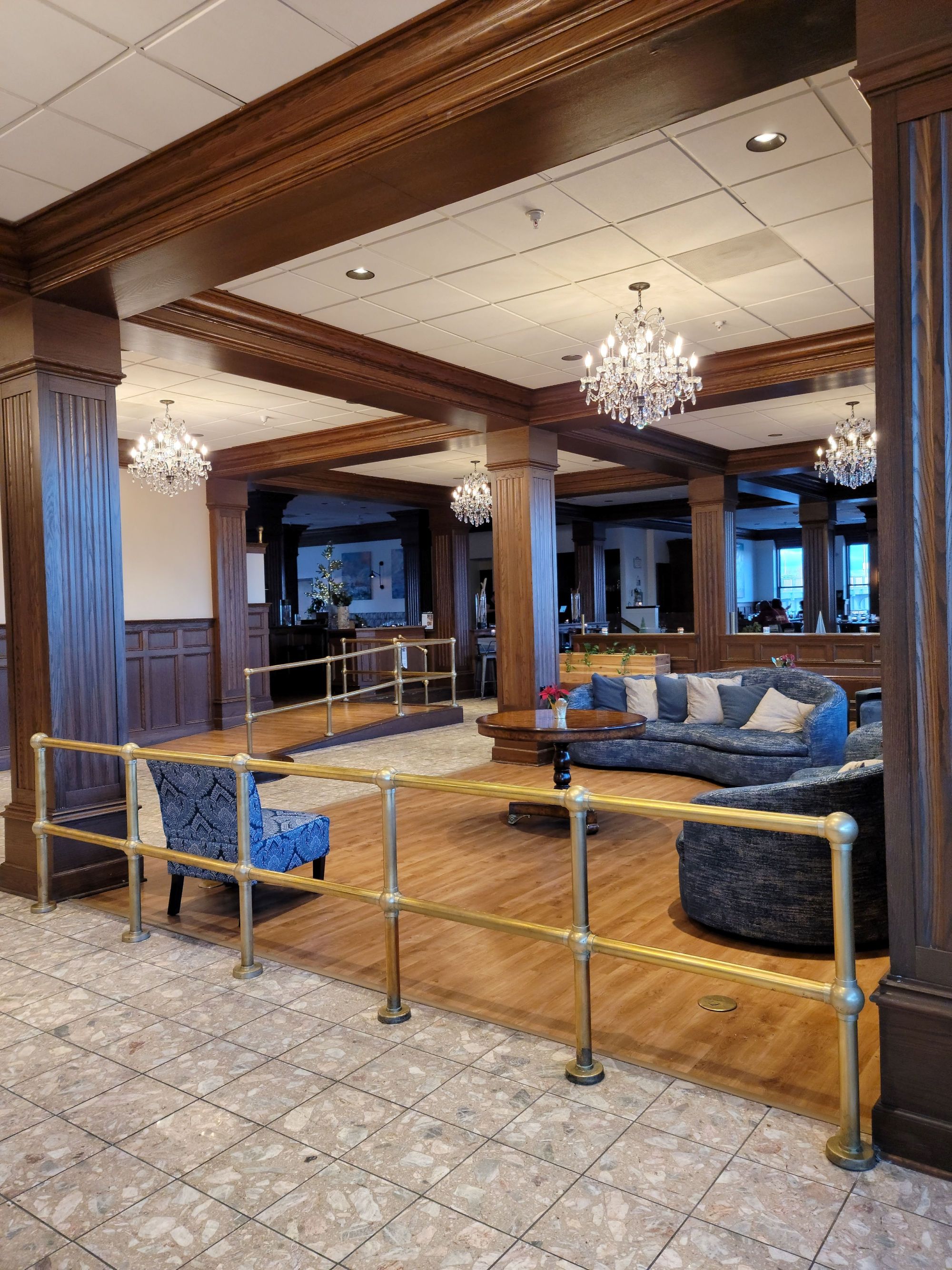 a room with a chandelier and couches