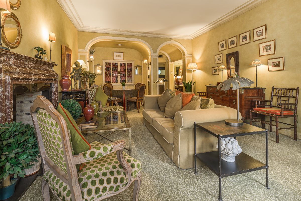 a living room with a couch and chairs