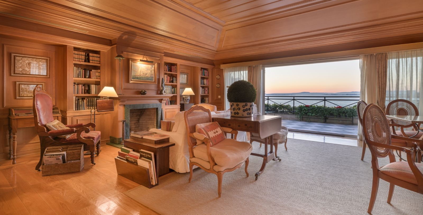 a living room with a fireplace and a large window