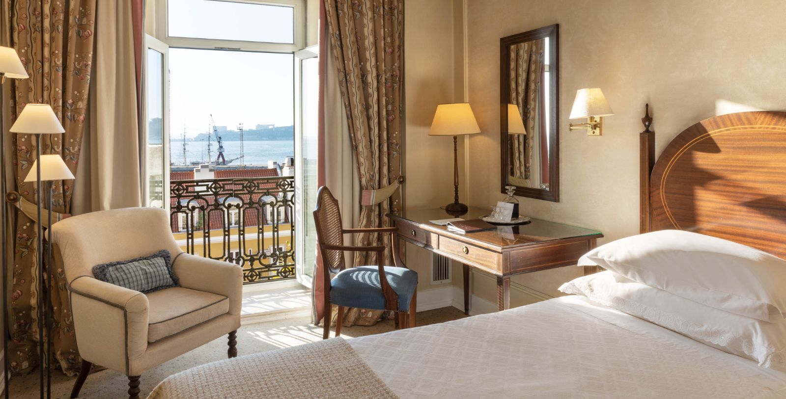a room with a bed and a desk and chair