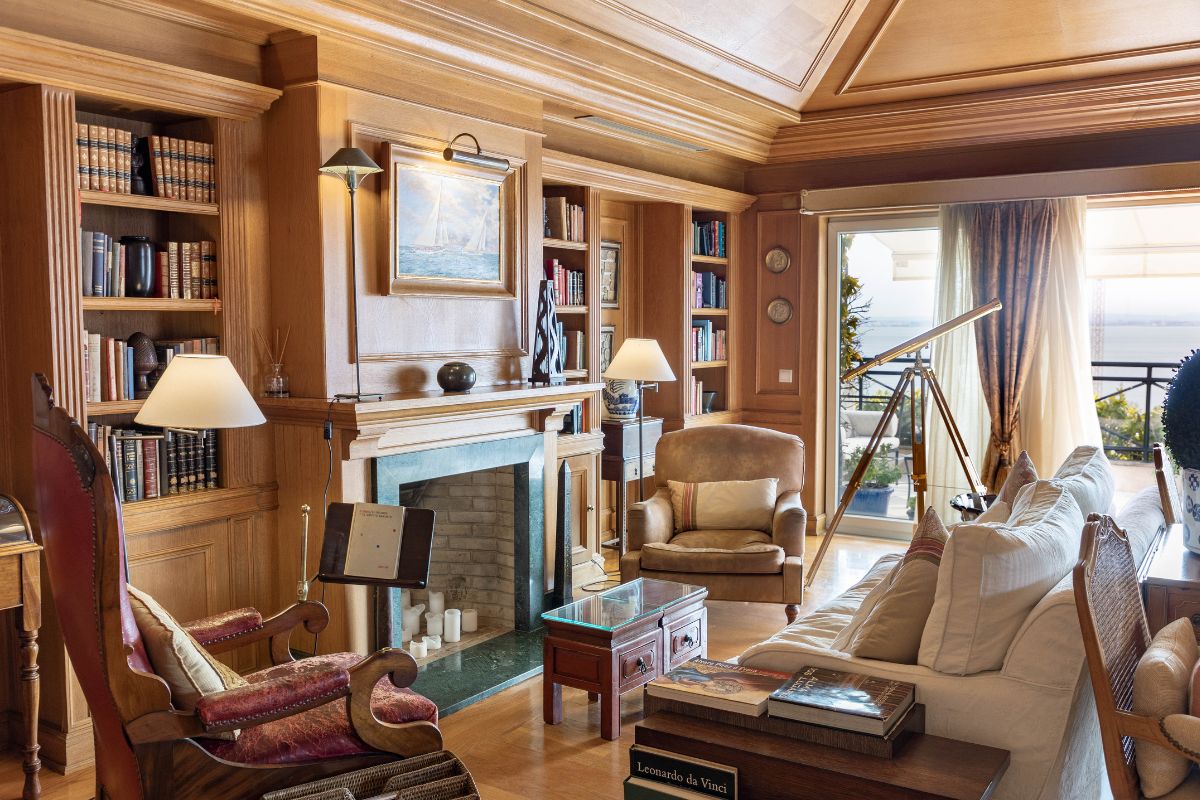 a living room with a fireplace and furniture