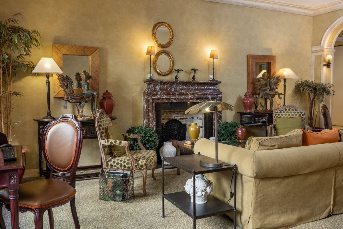 a living room with a fireplace and furniture