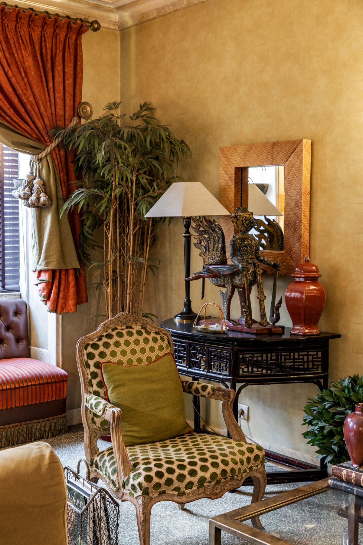 a room with a table and a chair and a lamp