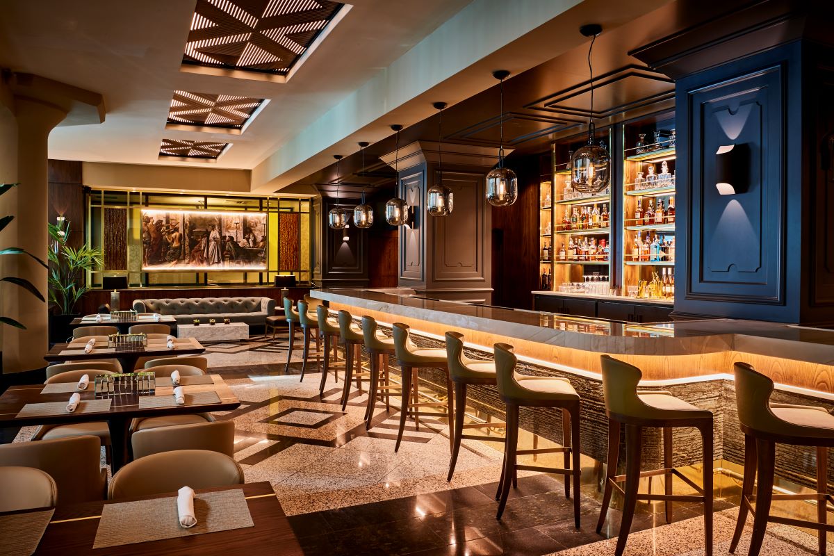 a bar with a bar and chairs