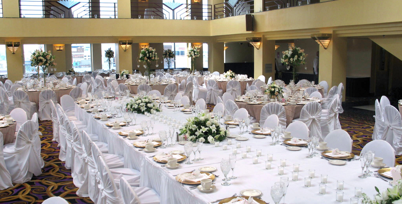 a large banquet hall with tables and chairs