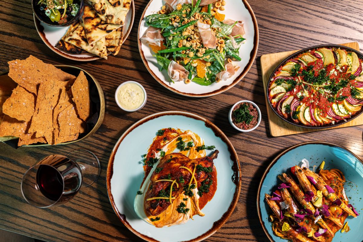 a table full of plates of food