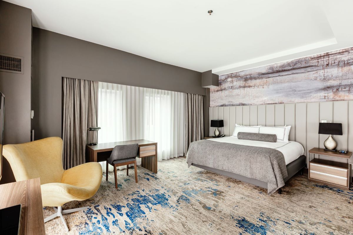 a room with a bed and a desk