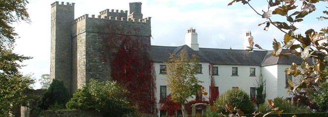 a white building with red vines
