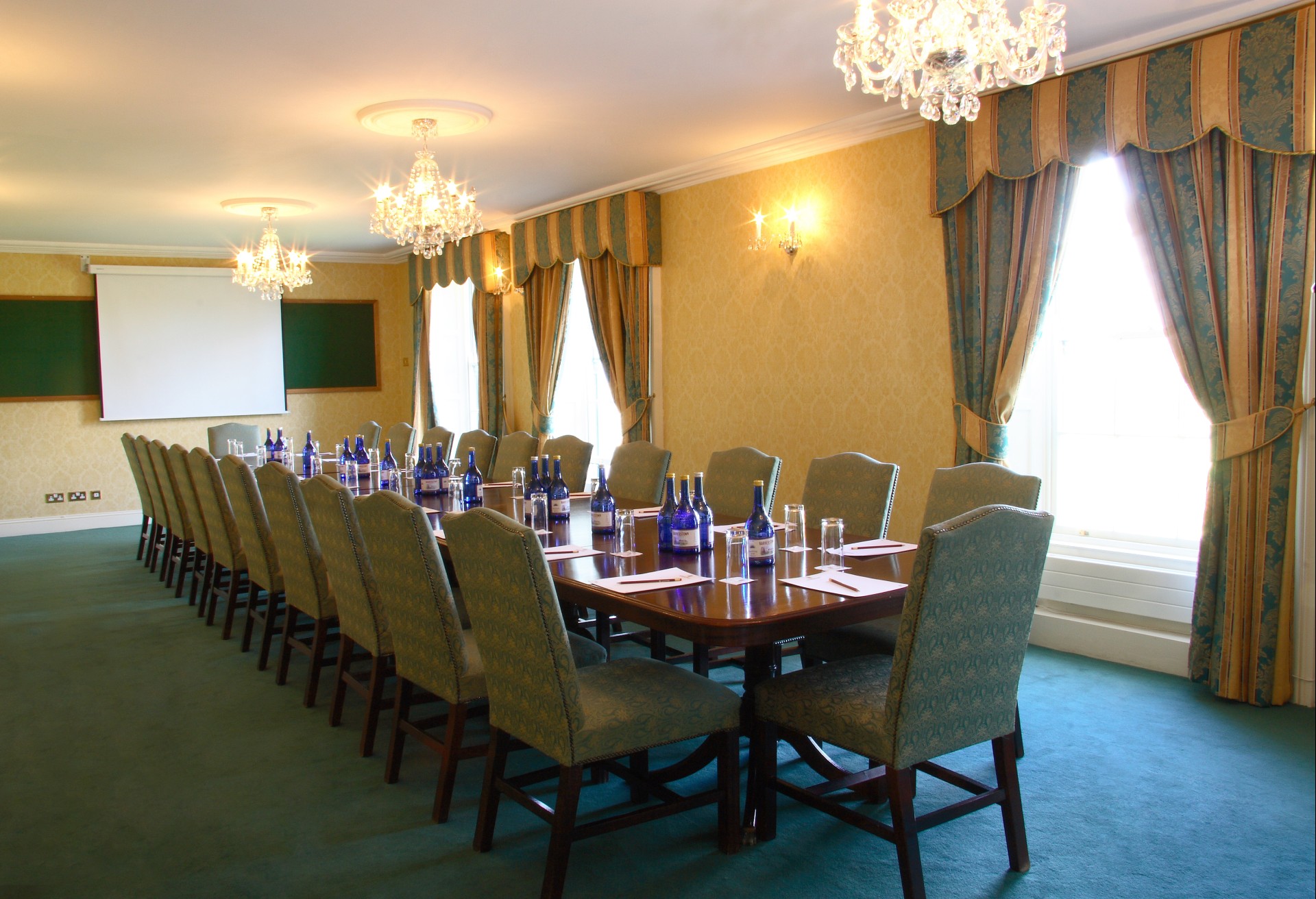 a long conference room with a table and chairs