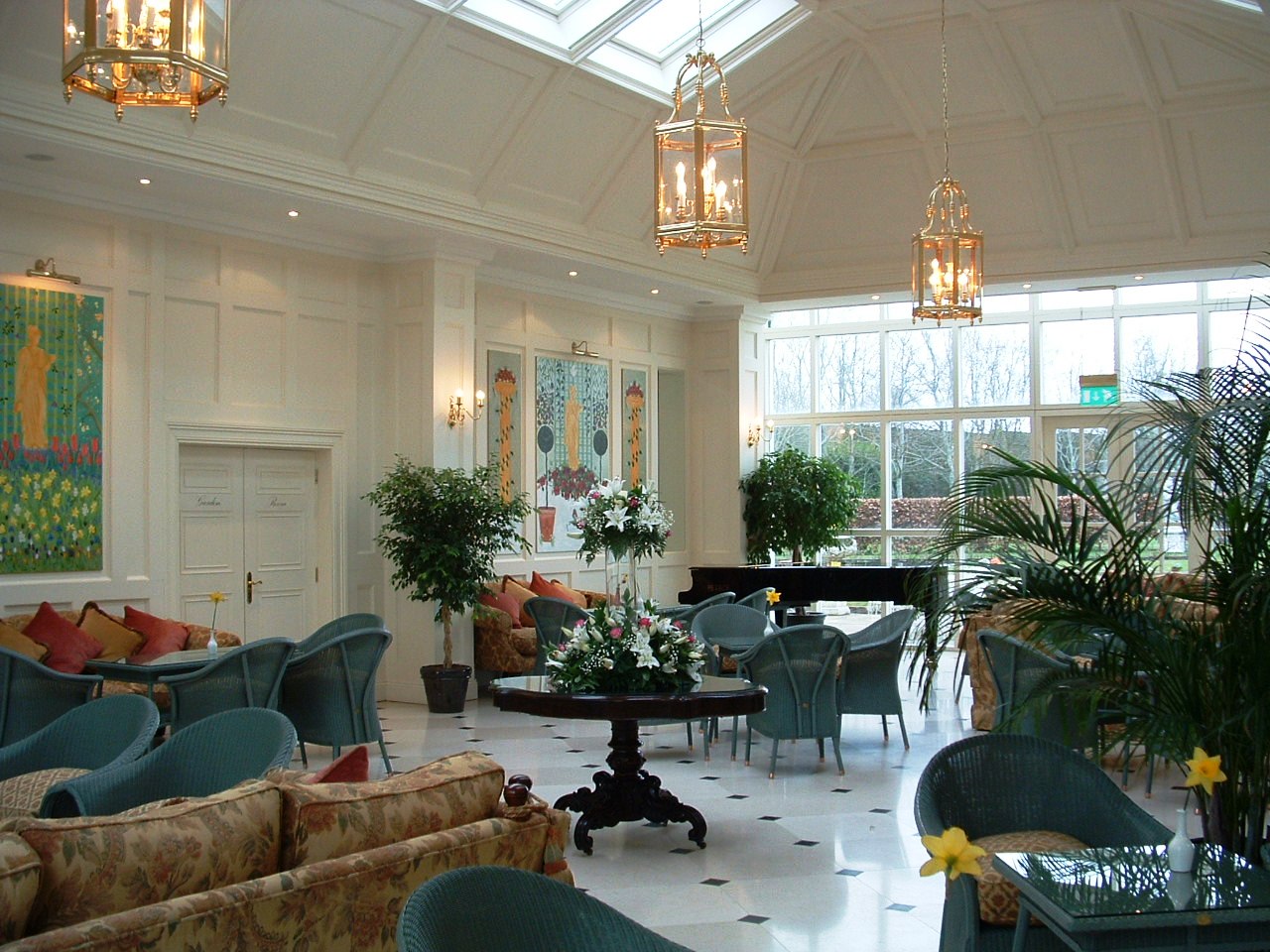 a room with a large ceiling and chandeliers
