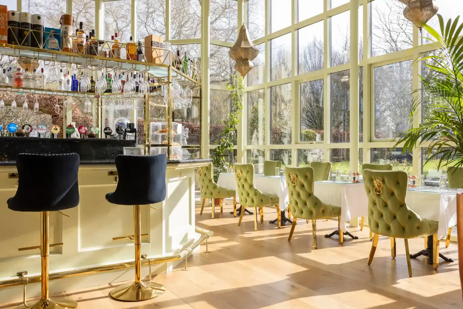 a room with a bar and chairs