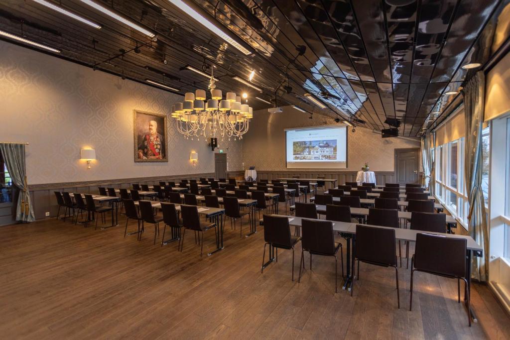 a room with chairs and a projector