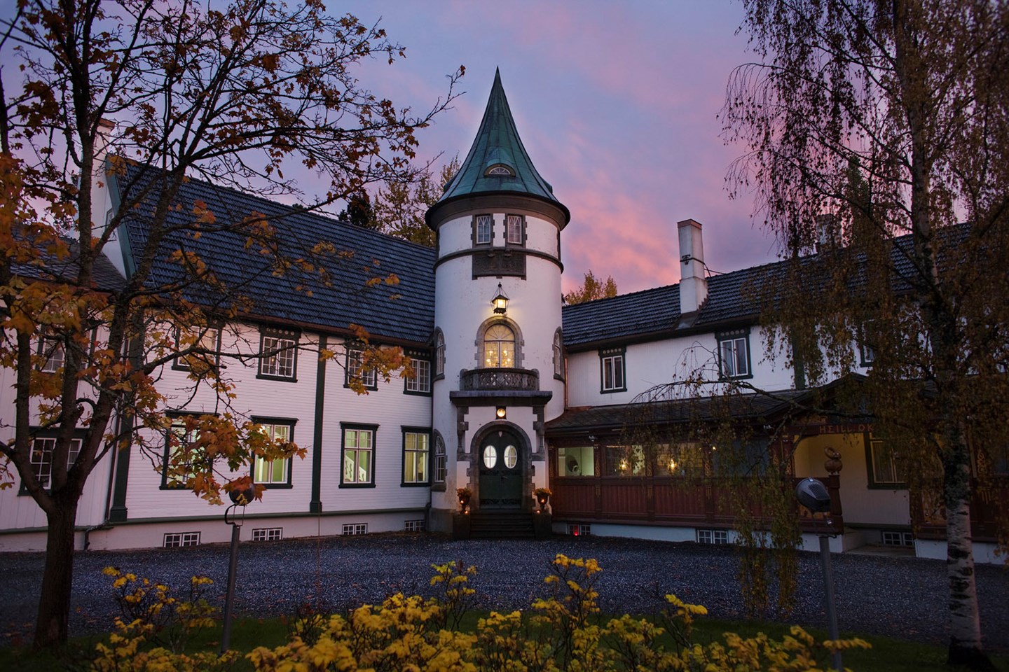 a large white house with a pointed roof