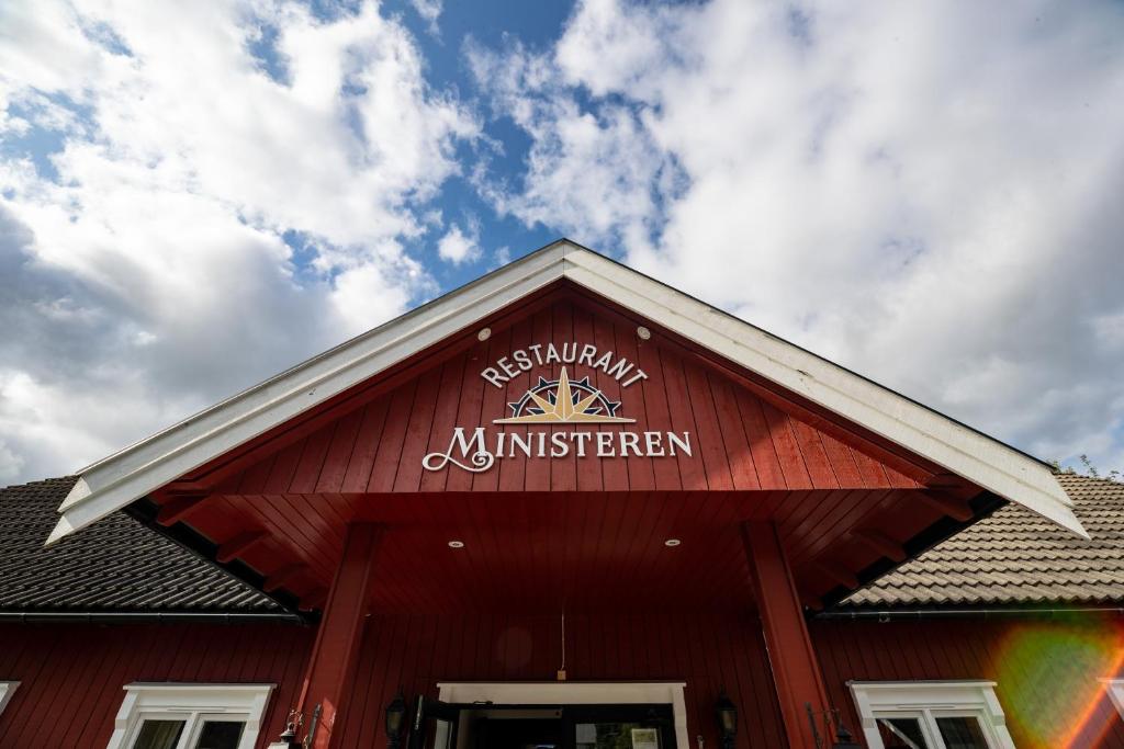 a red building with a sign on the roof