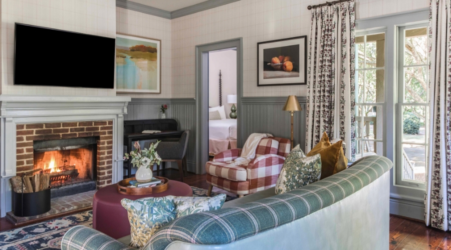 a living room with a fireplace and couches