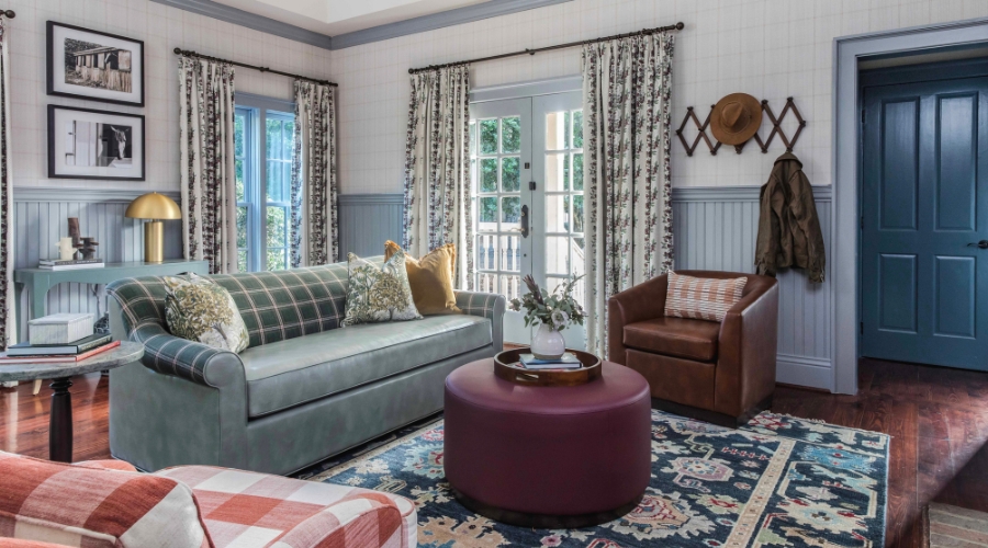 a living room with couches and chairs