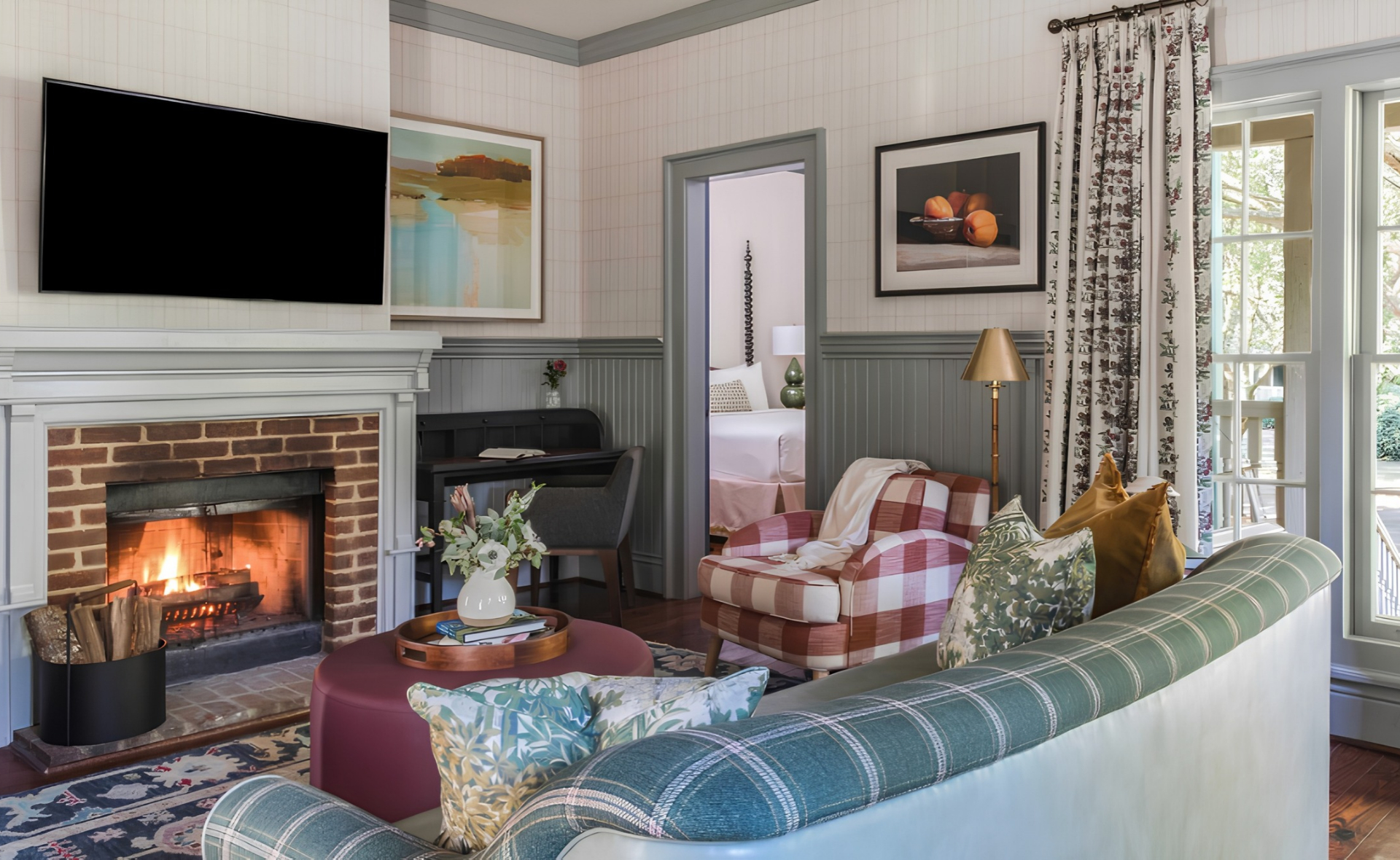 a living room with a fireplace and couches