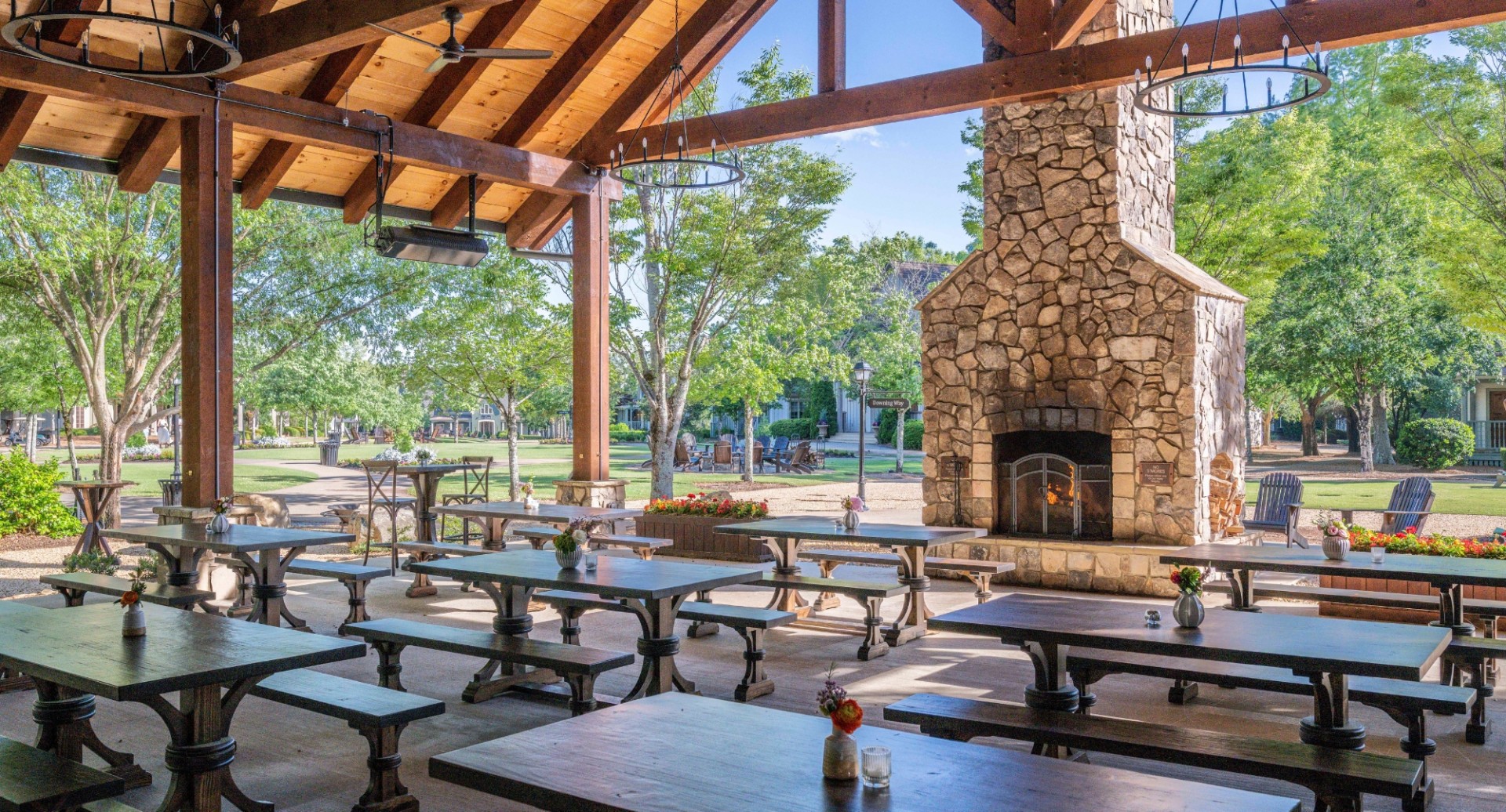 a large outdoor patio with tables and chairs