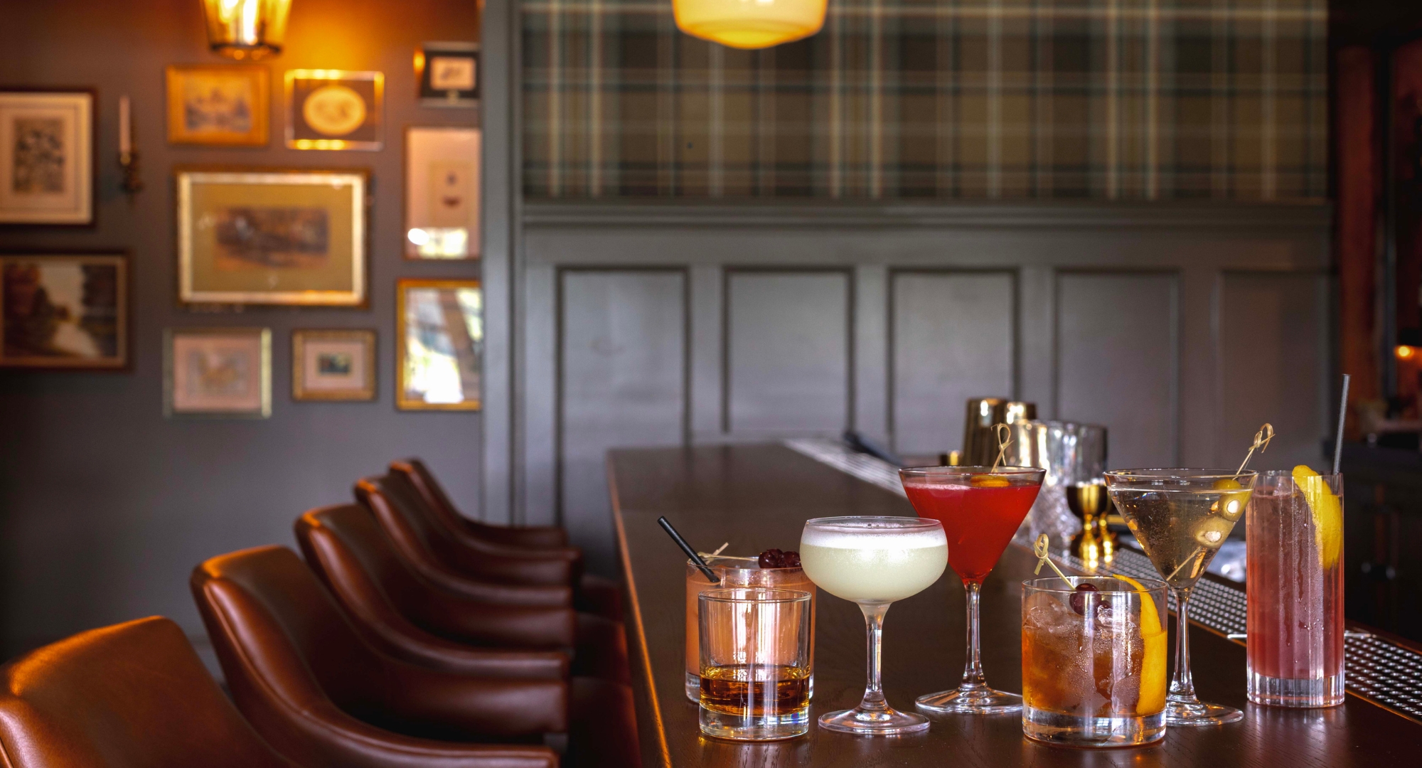 a group of glasses on a bar