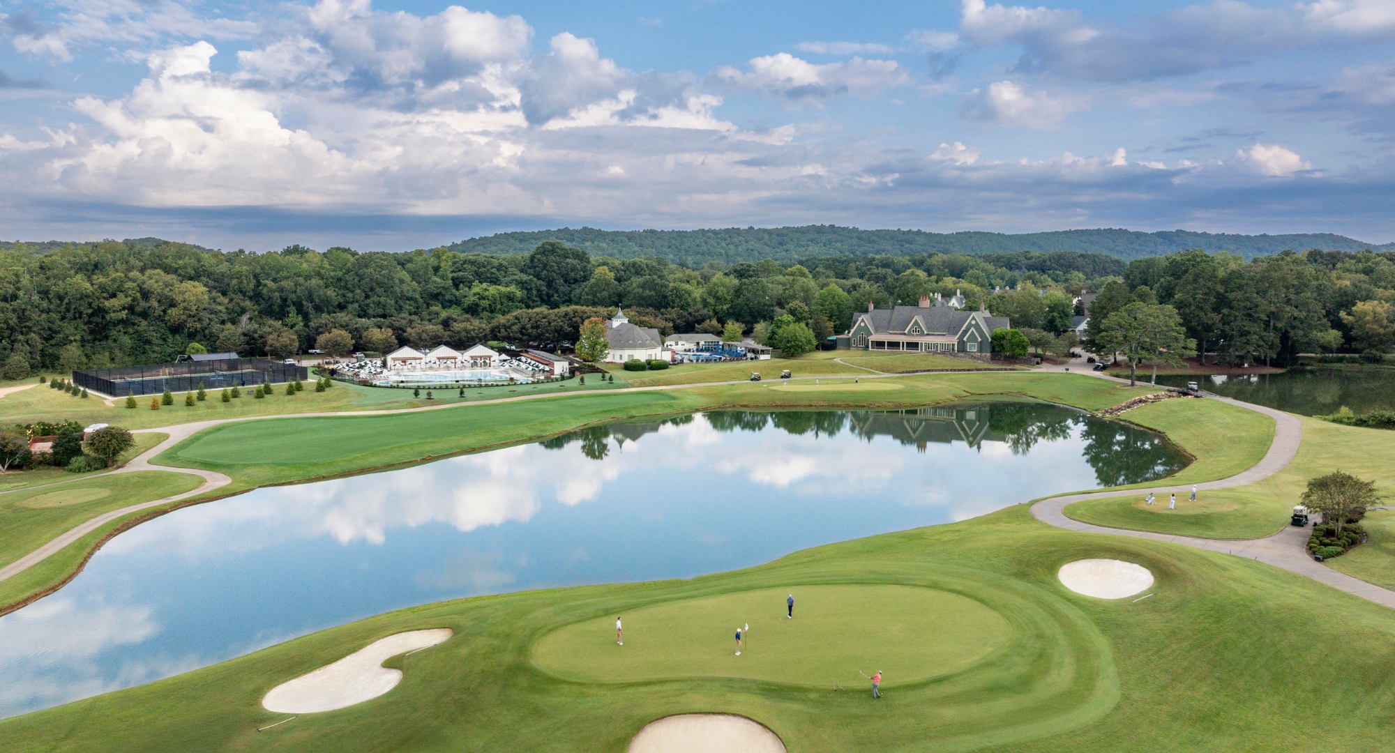 a group of people on a golf course