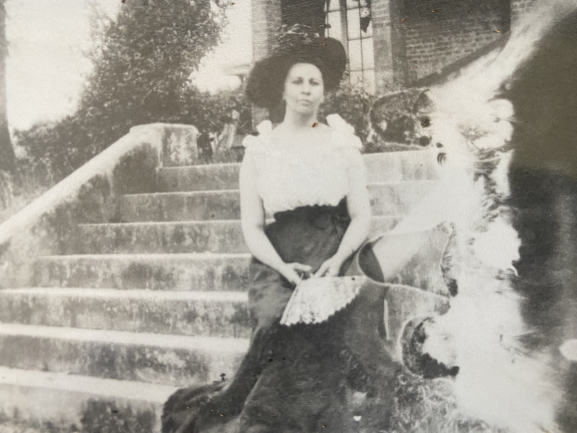 a woman sitting on stairs