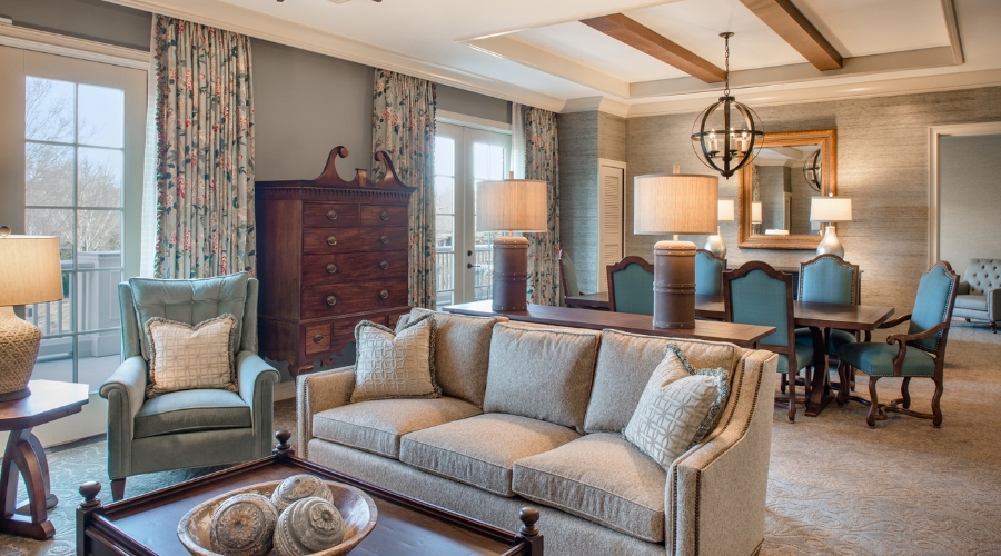 a living room with a couch and a dresser