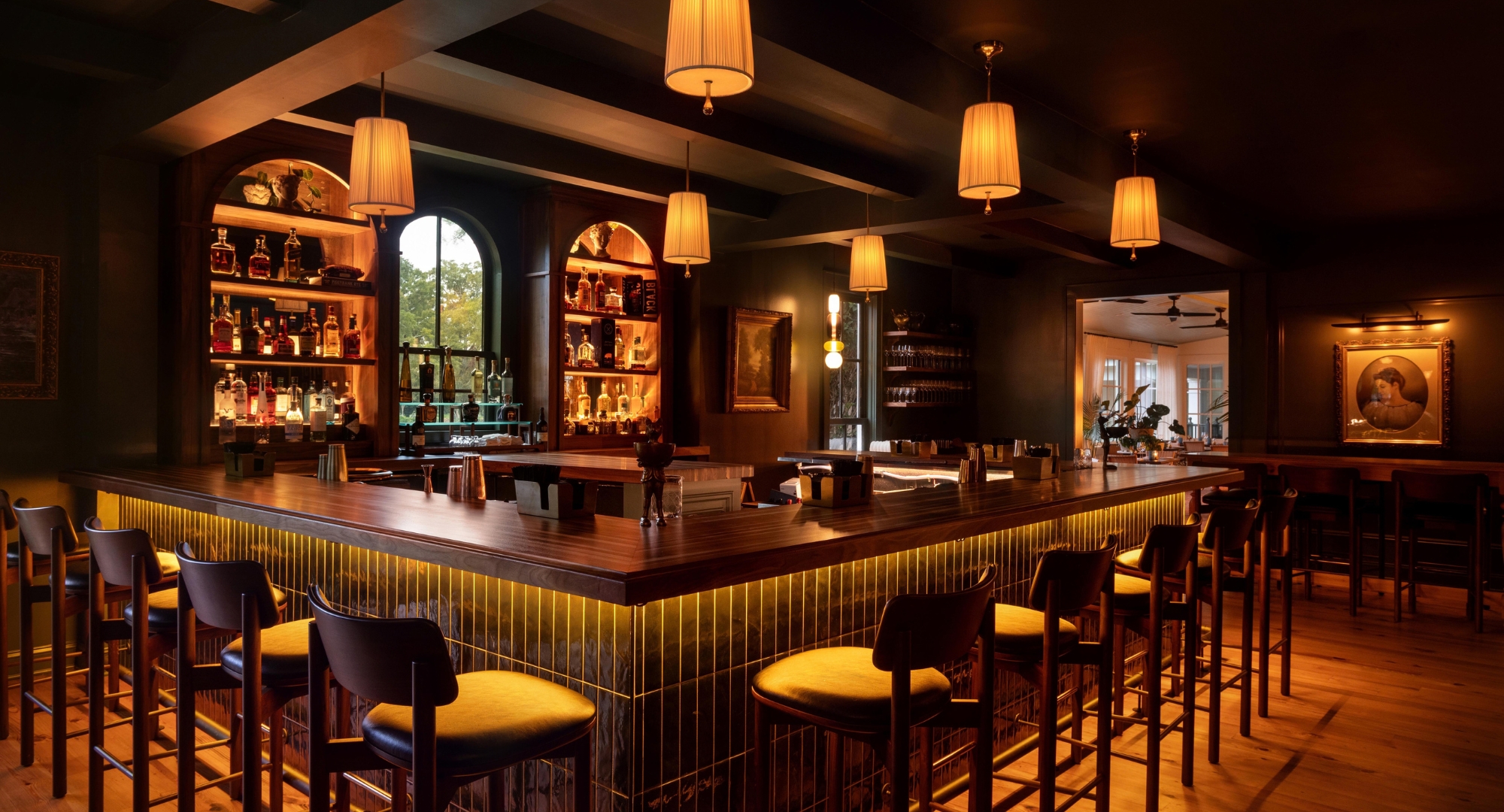 a bar with chairs and lights