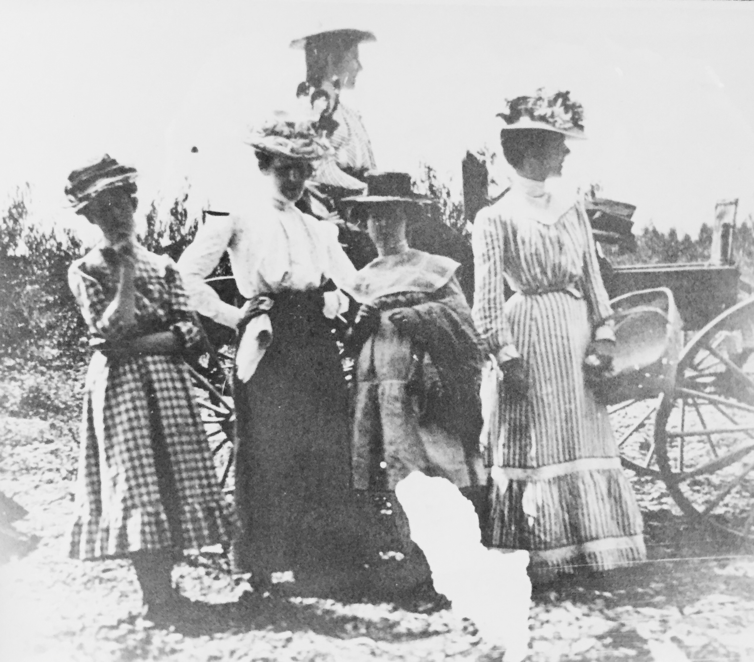 a group of women standing outside