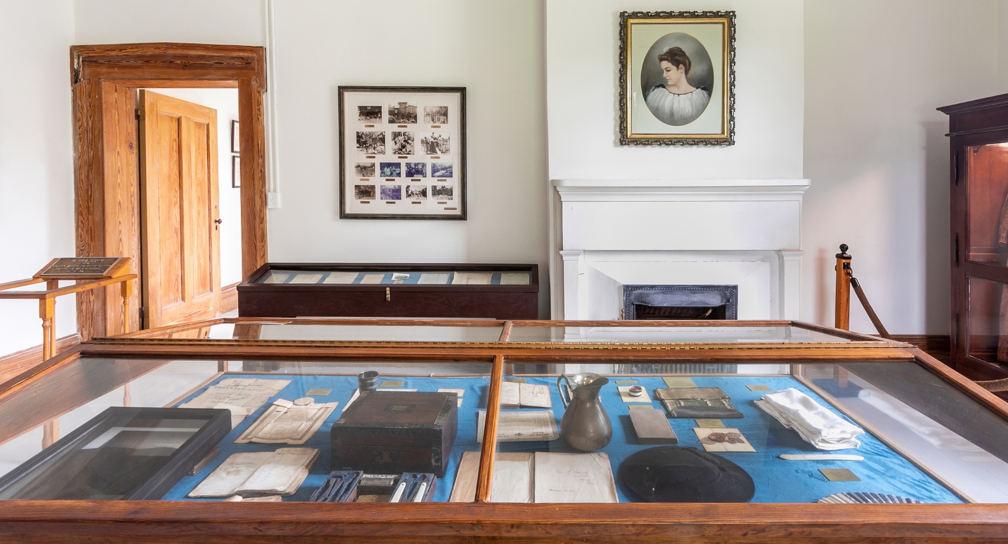 a room with a glass case with objects on it