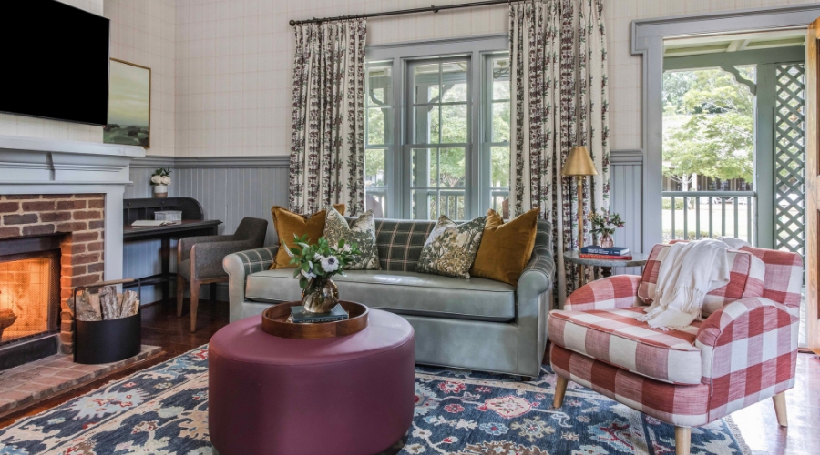a living room with couches and chairs