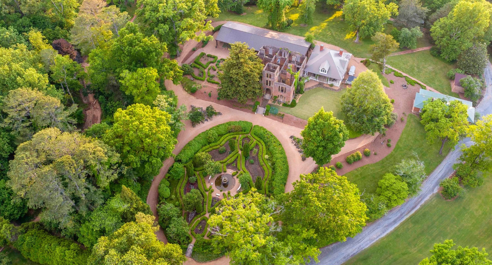 a large garden surrounded by trees
