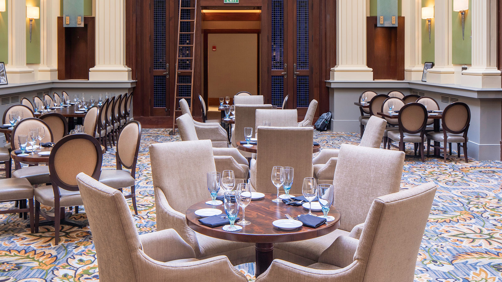 a room with chairs and tables
