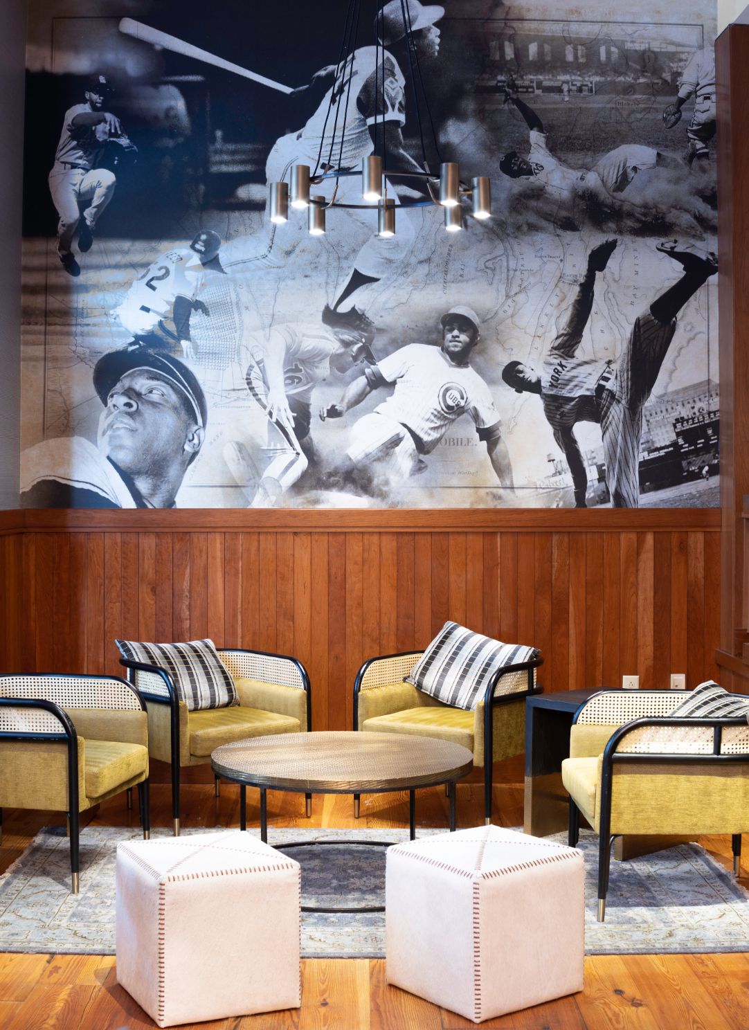 a room with a large mural of baseball players