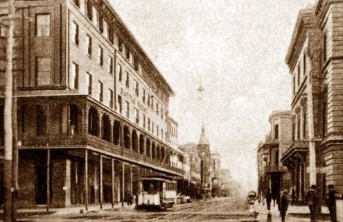 a street with buildings and cars