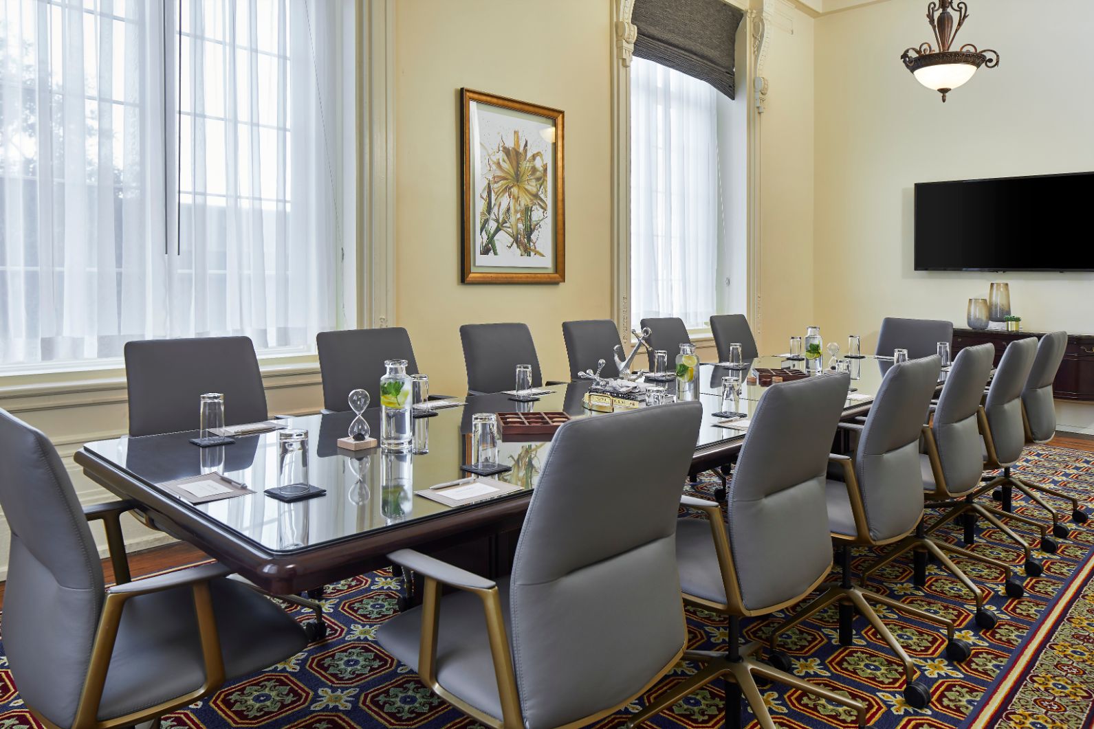 a conference room with a table and chairs