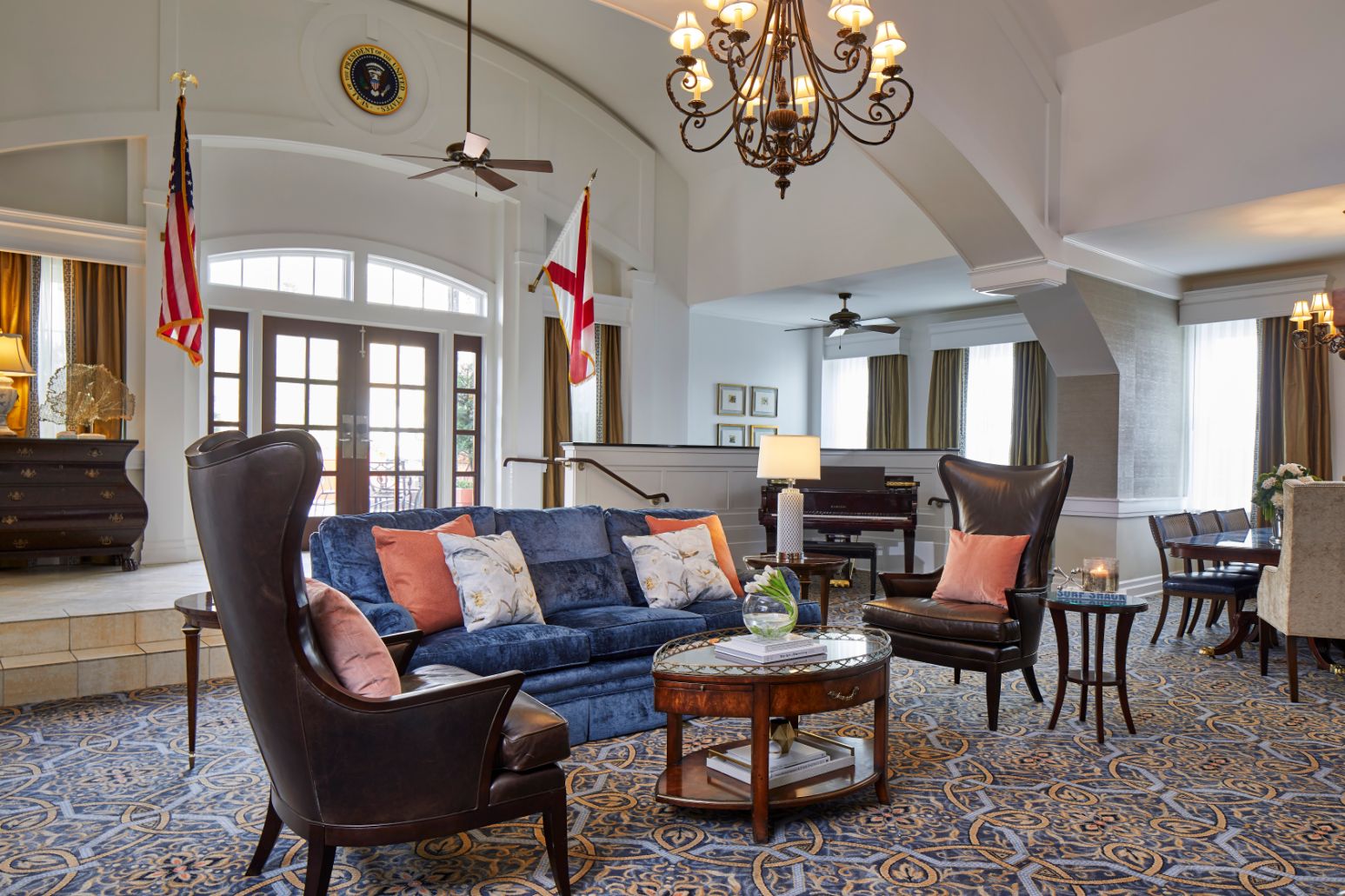 a living room with a couch and chairs