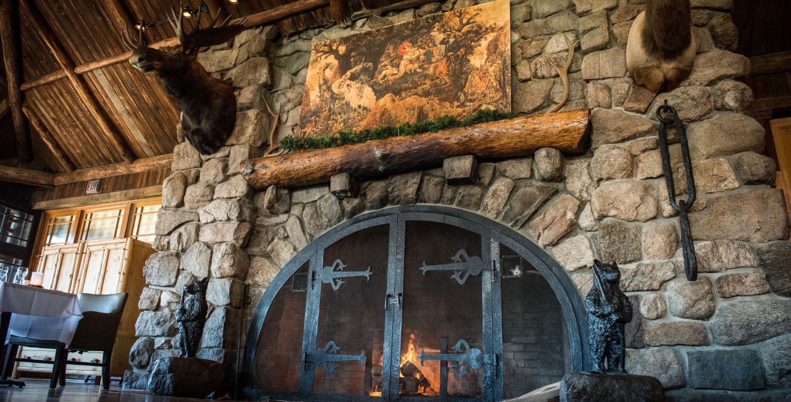 a fireplace with a painting on the wall
