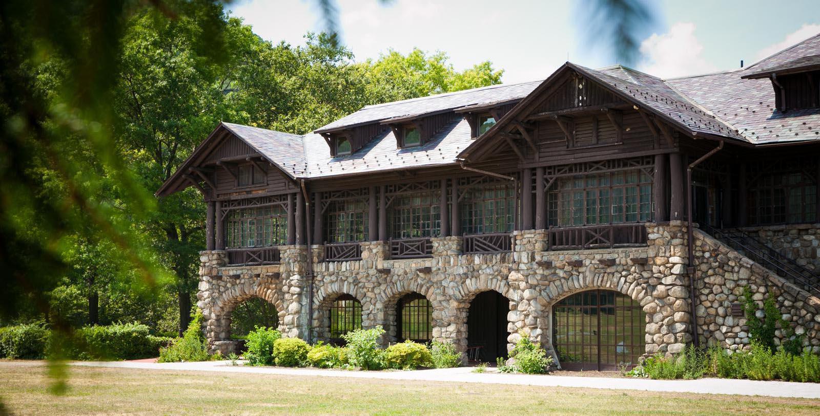 a building with a stone wall and a stone arch
