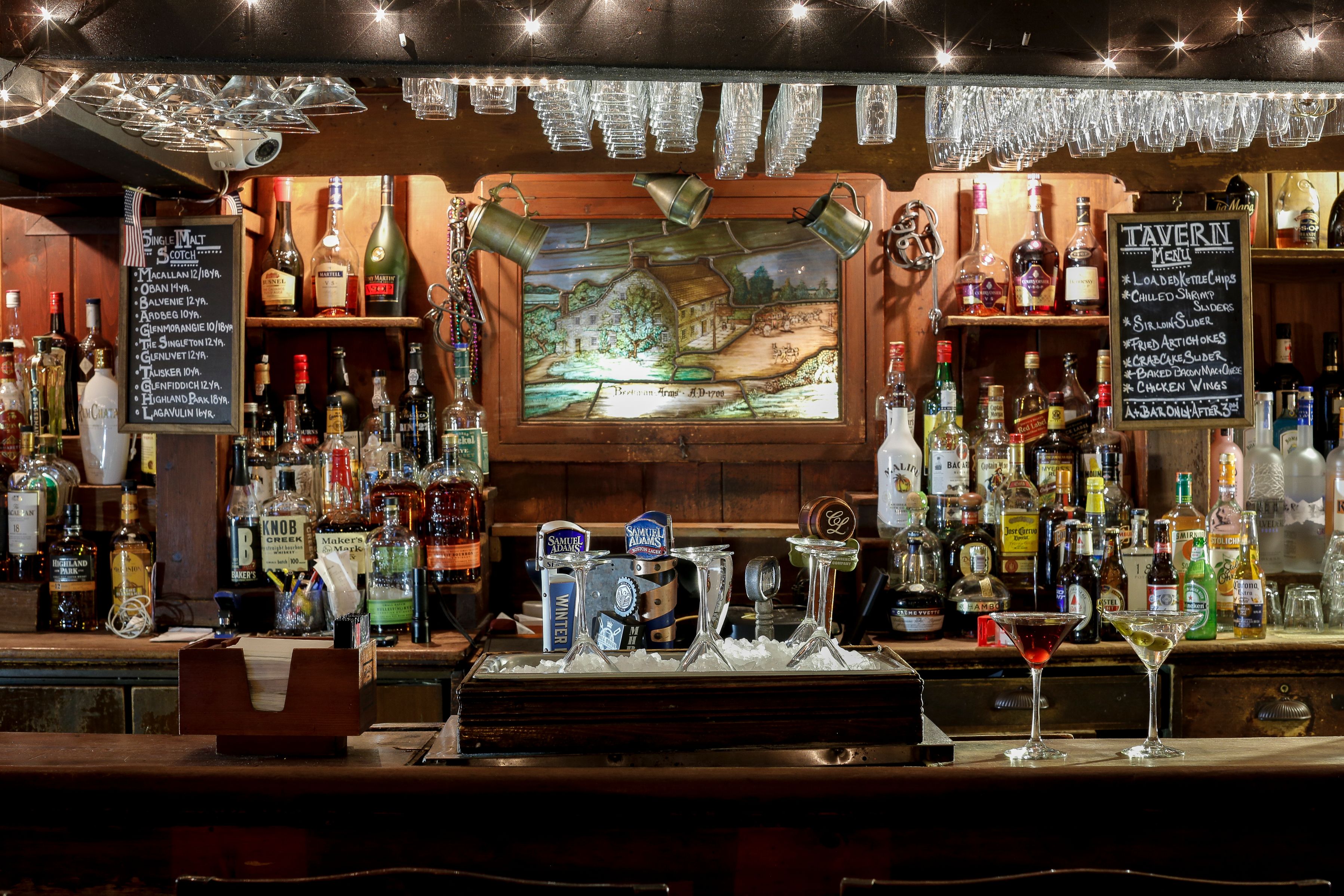 a bar with many bottles of alcohol