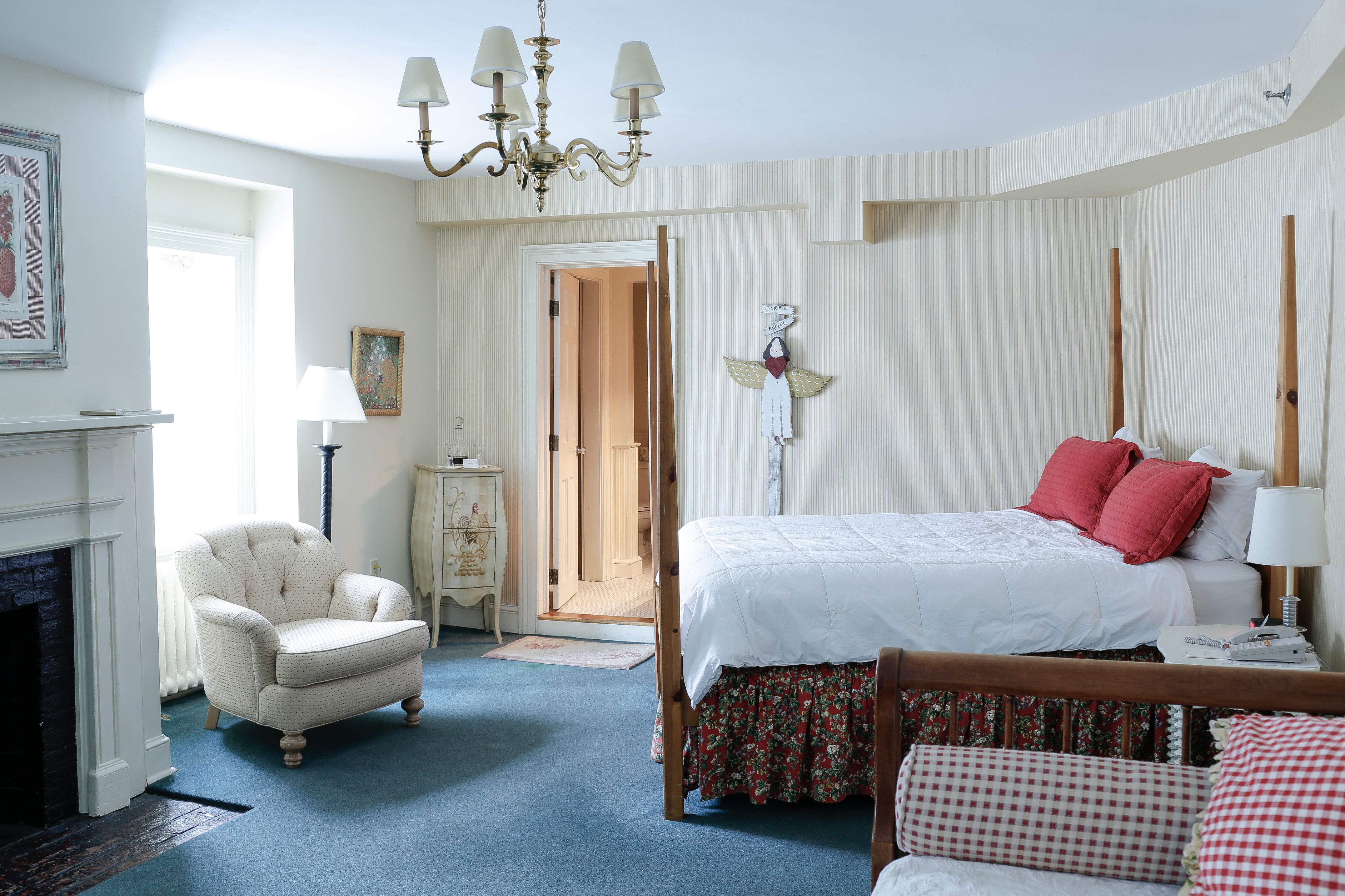 a bedroom with a bed and a chair