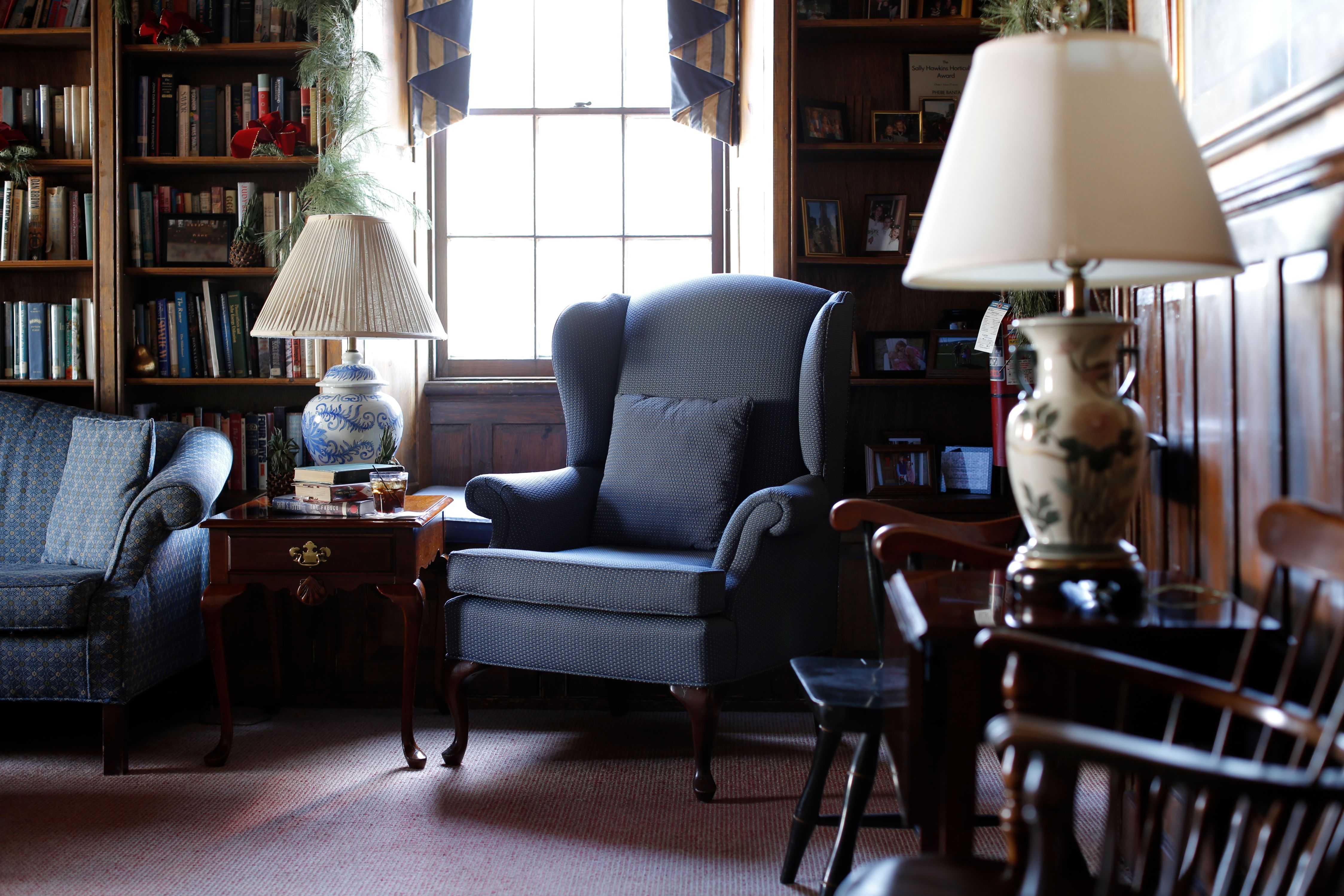 a room with a chair and a lamp