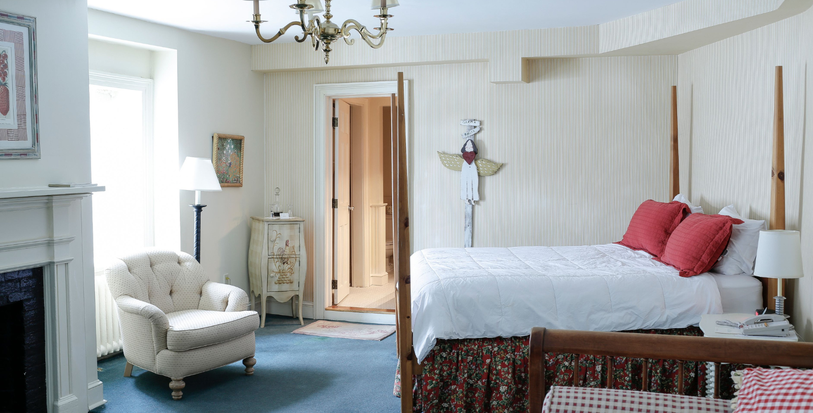a bedroom with a bed and a fireplace
