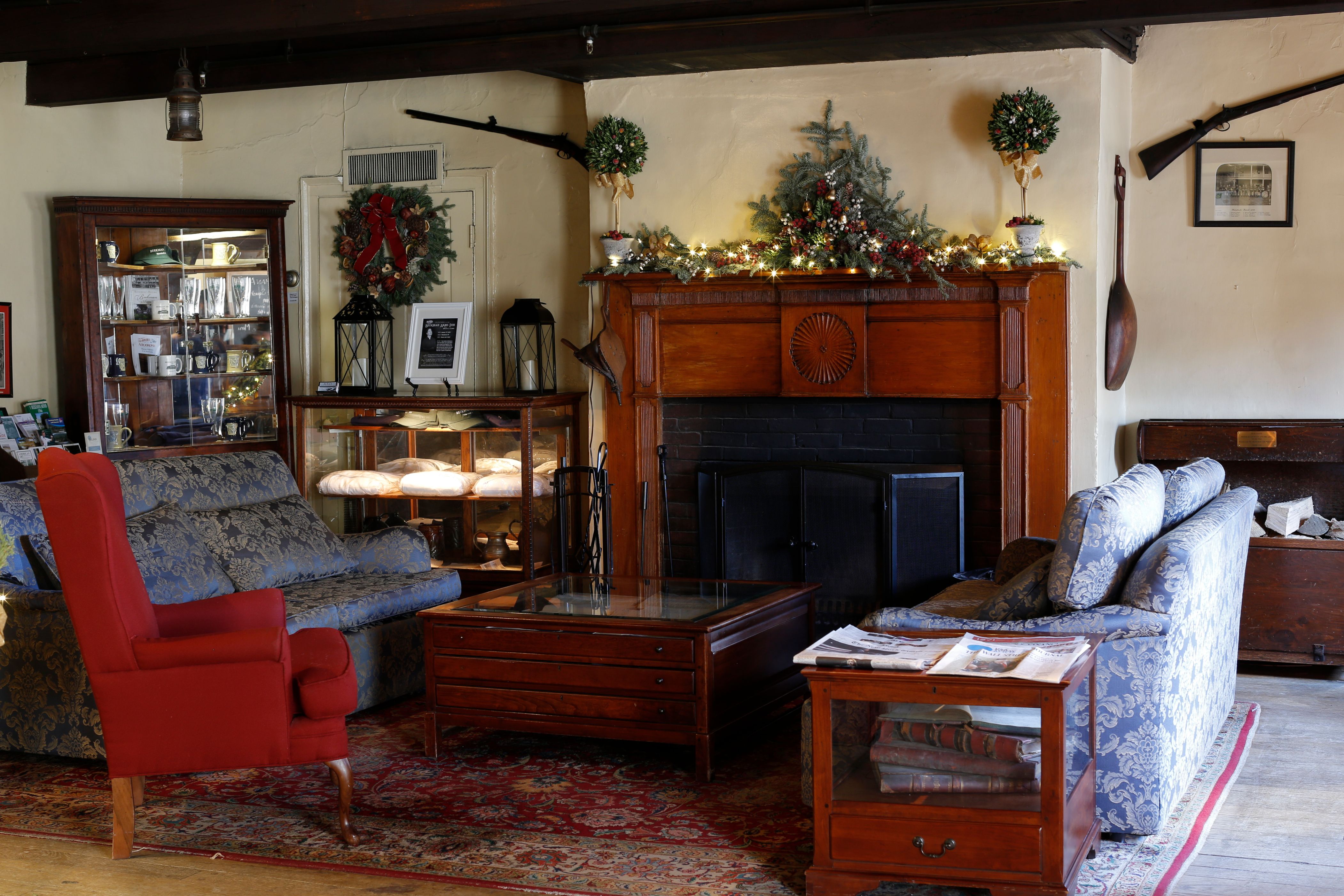 a living room with a fireplace and furniture