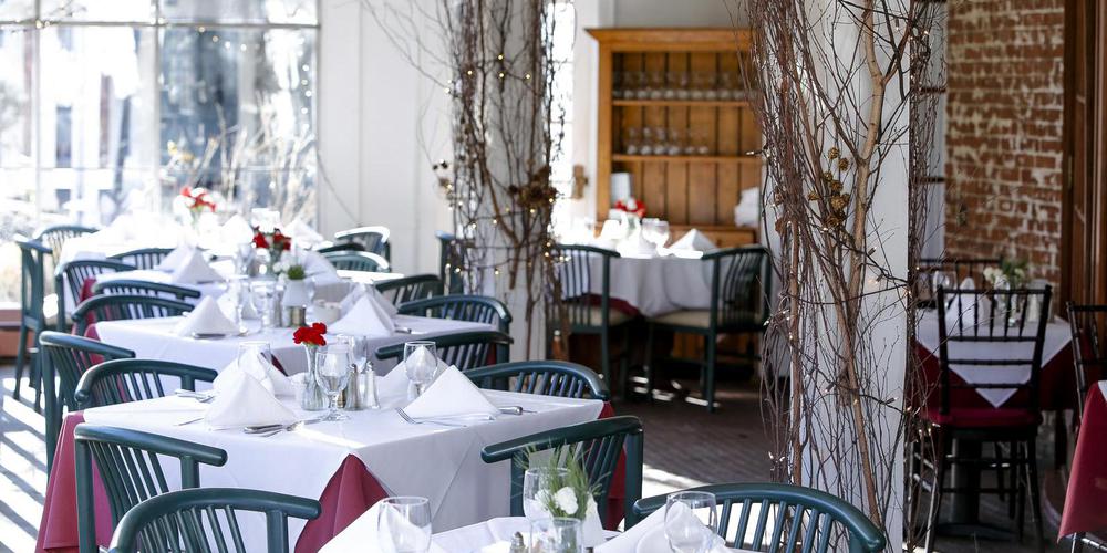 a restaurant with tables and chairs